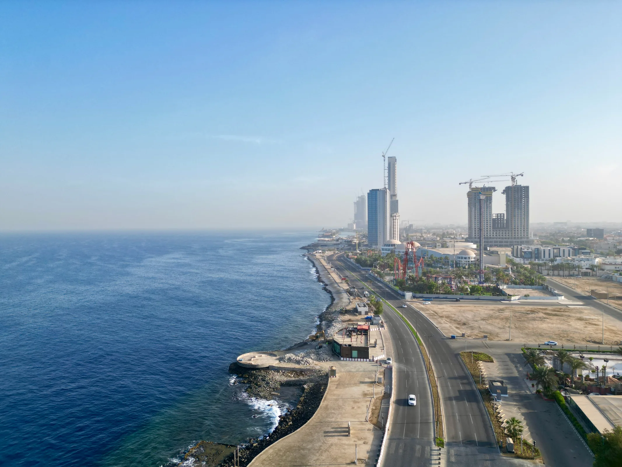 Open spaces and pathways framing the shoreline