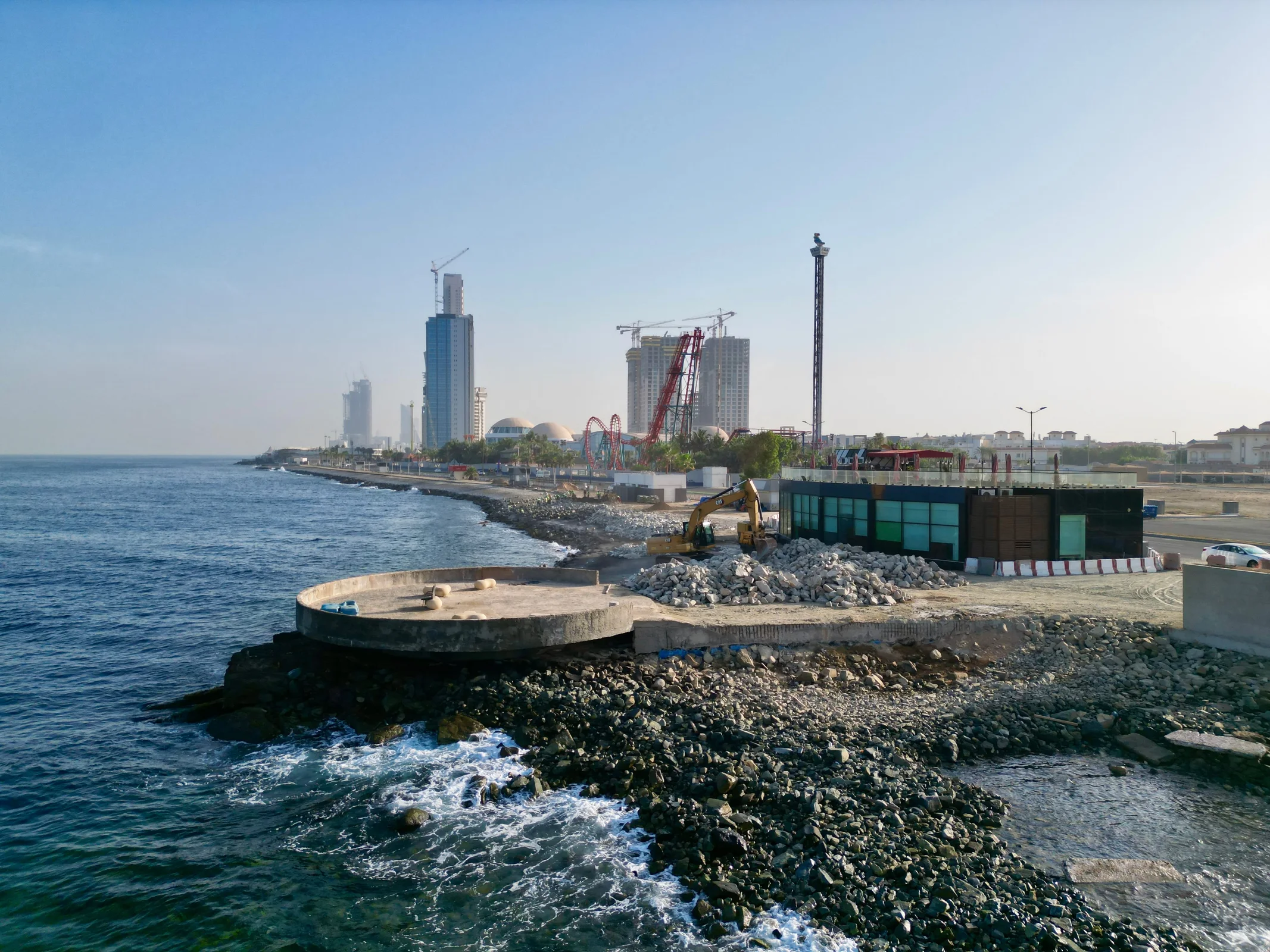 Open spaces and pathways framing the shoreline