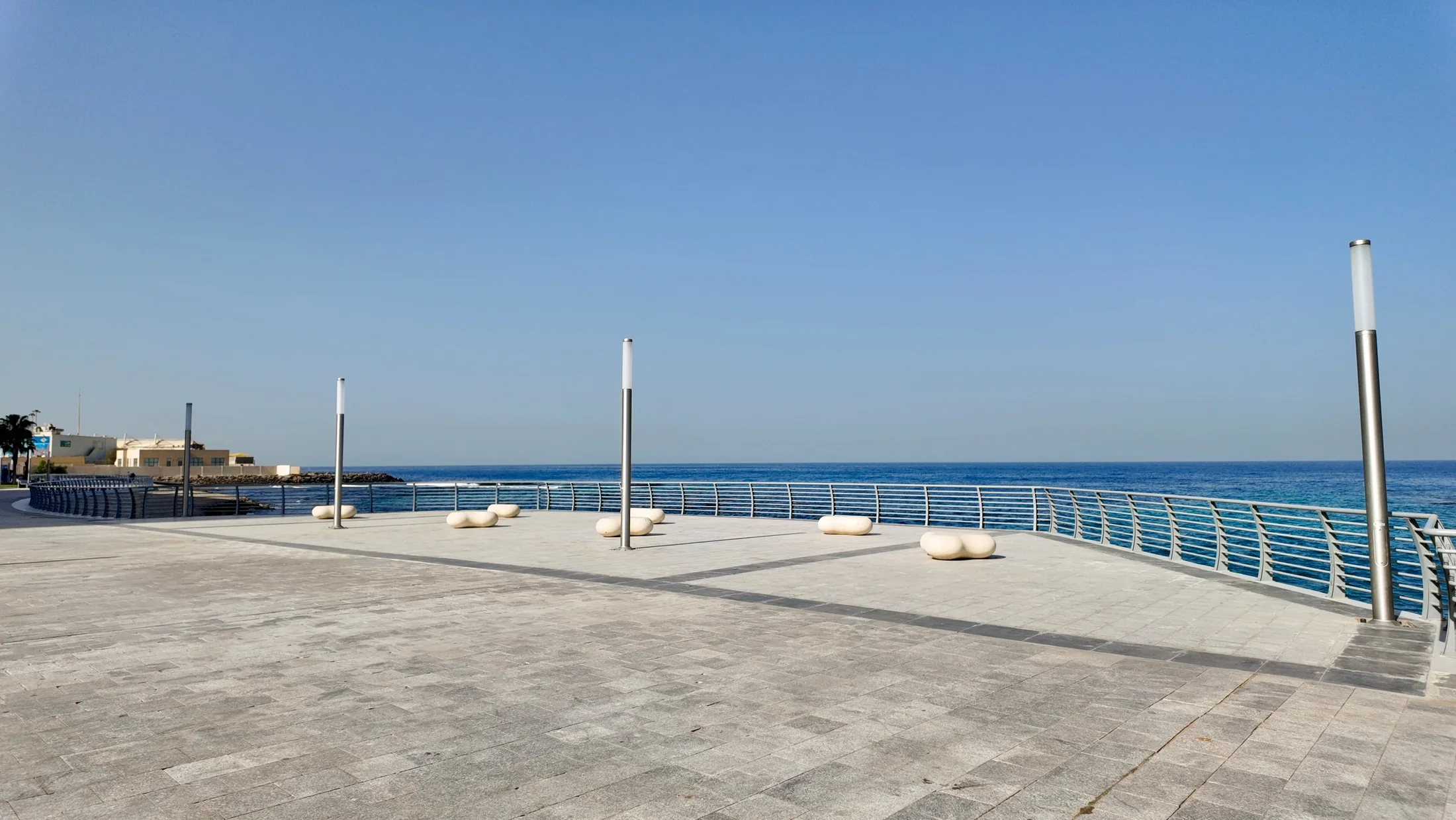 Open spaces and pathways framing the shoreline